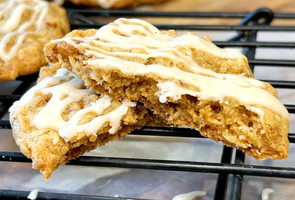 Brown butter oatmeal cookie broken open to show the soft chewy center.