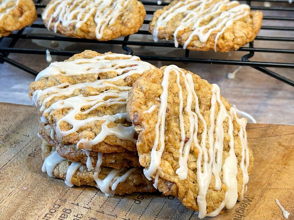 Brown butter maple pecan oatmeal cookies drizzled with maple glaze.